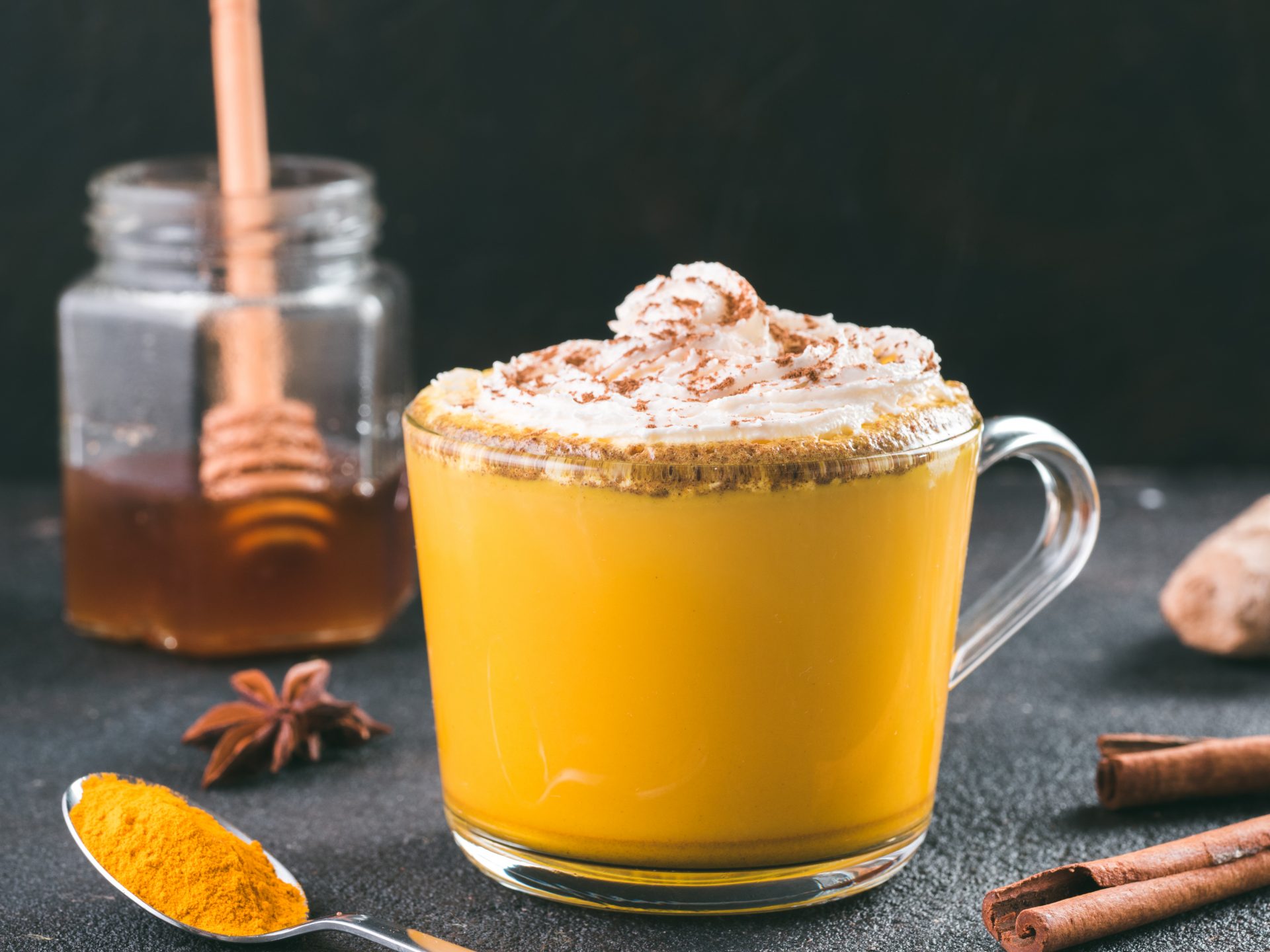golden turmeric latte and ingredients, copy space