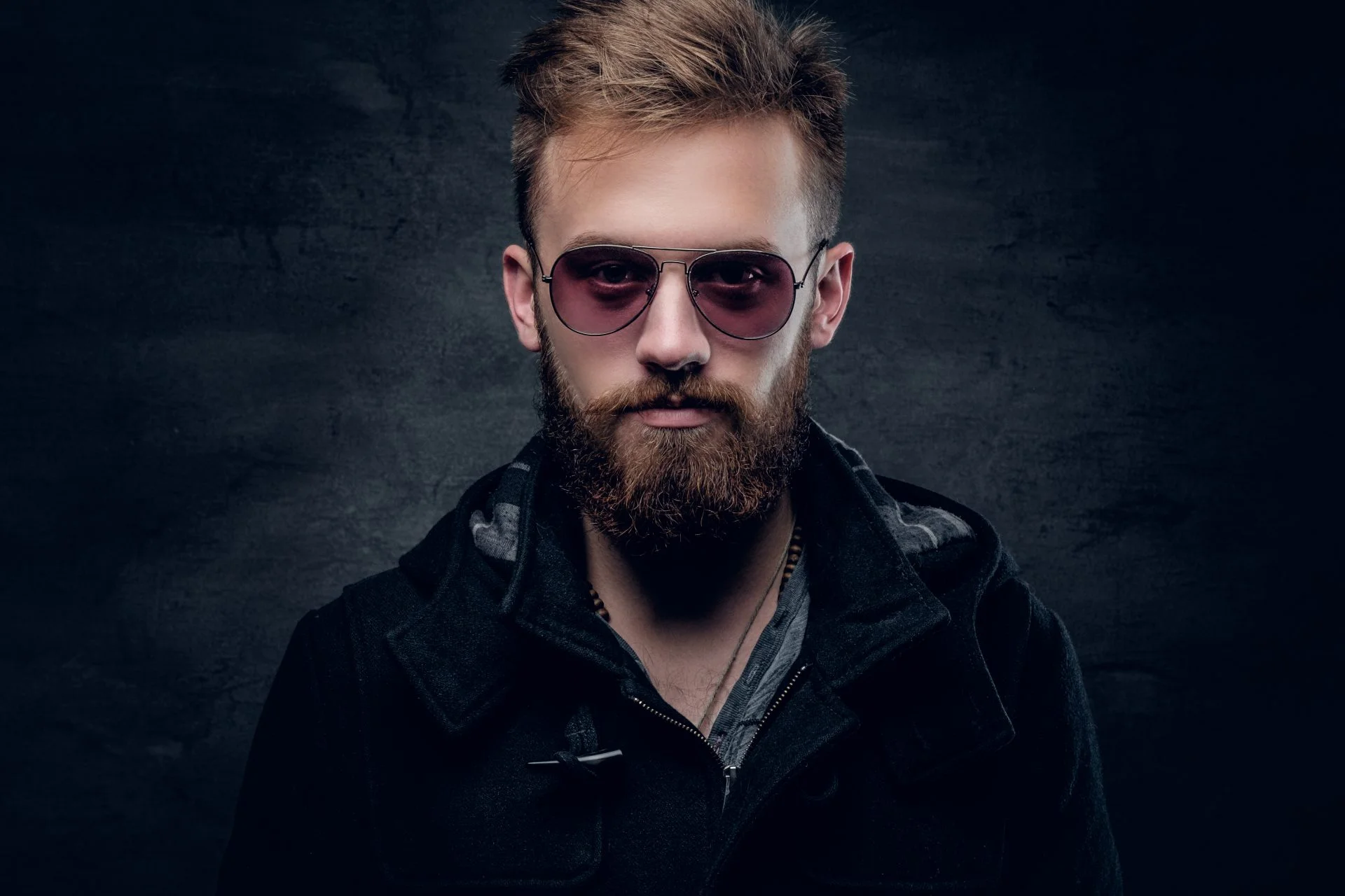Portrait of bearded man in sunglasses.