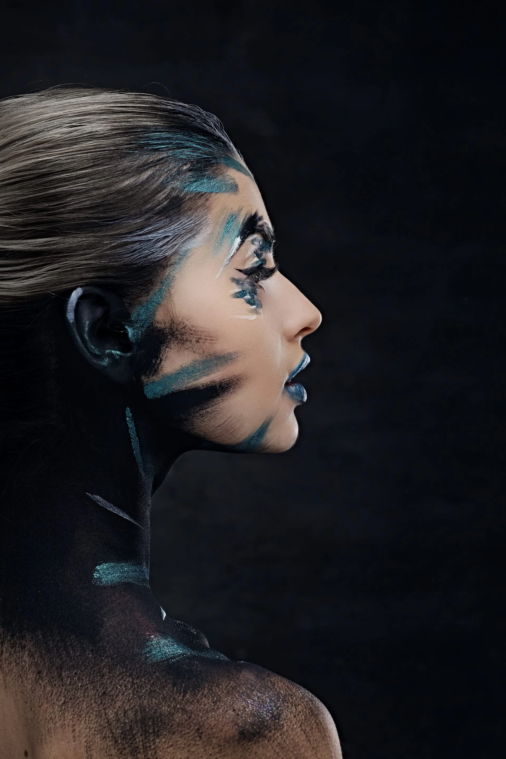 Side view portrait of a woman with make up.