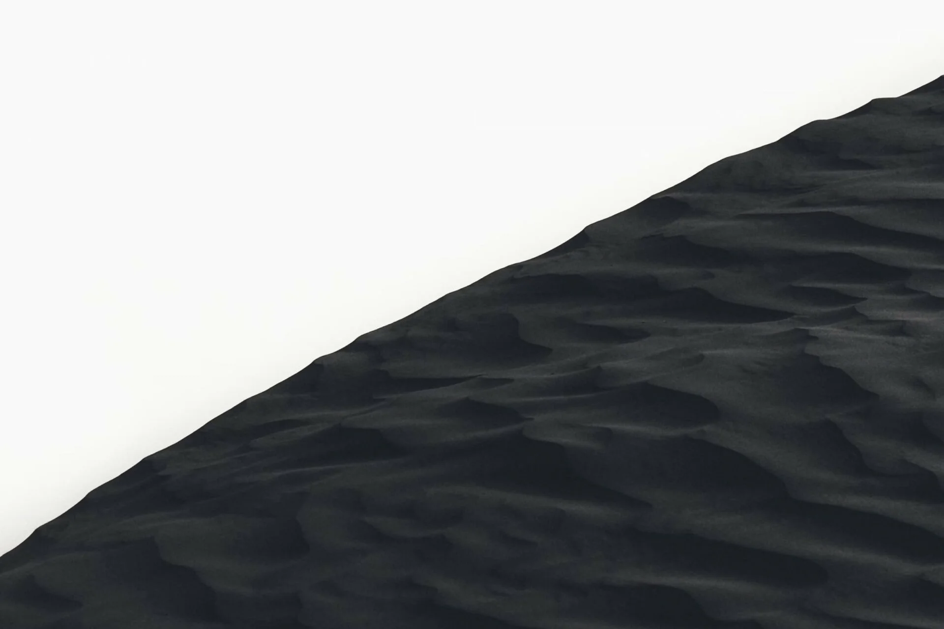 Grayscale photo of sand dunes