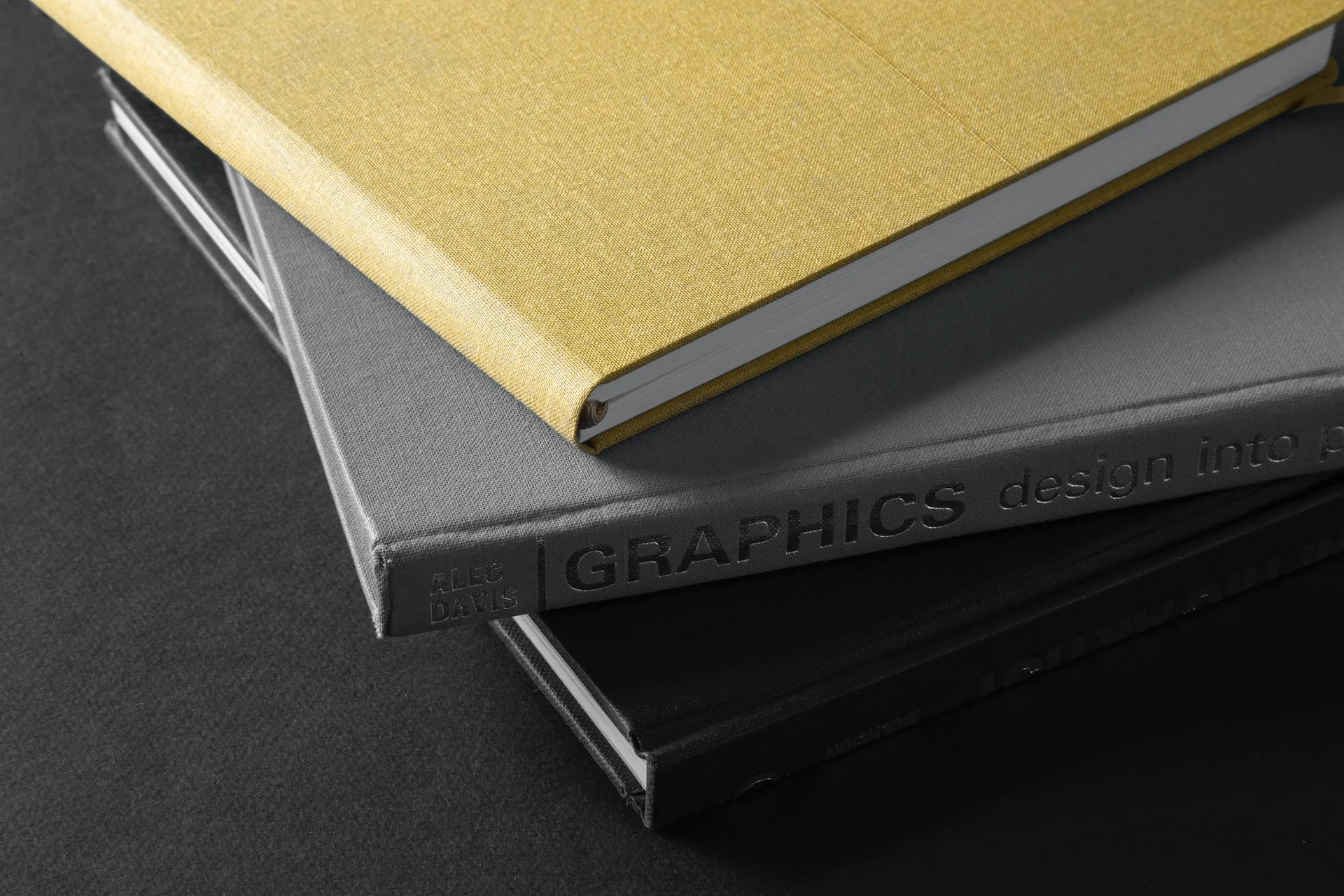 Brown hardbound book on black book