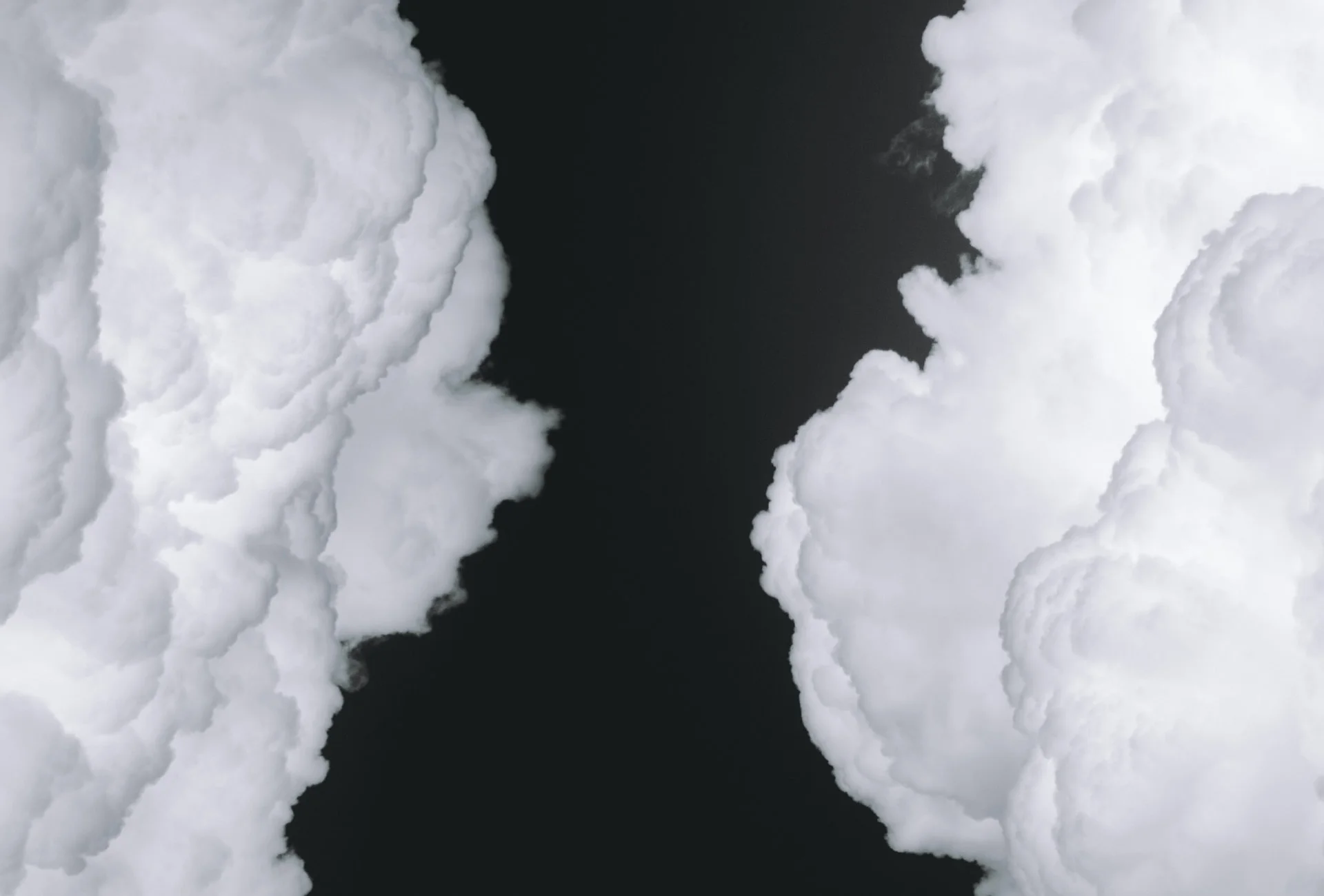 White clouds on black background